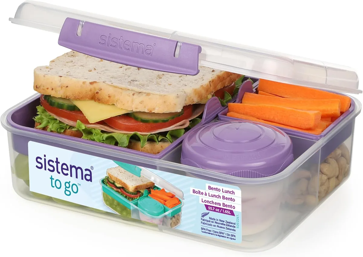 Fiambrera Sistema TO GO Bento Lunch transparente y morada con sándwich, zanahoria, frutos secos y recipiente pequeño